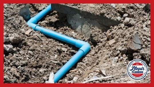 A blue pipe laid in the ground exposed