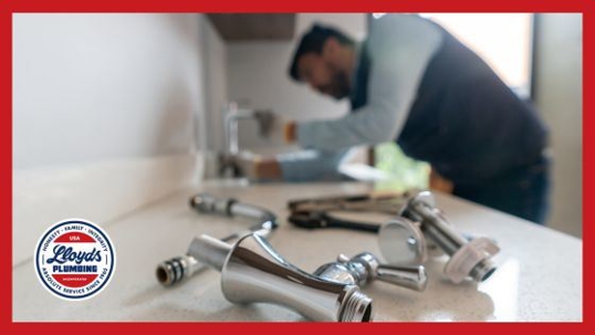 Plumber fixing sink.