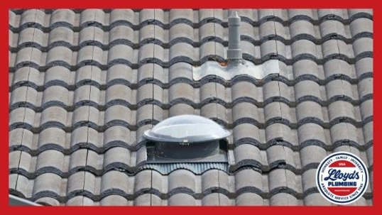 A plumbing vent on the roof of a home
