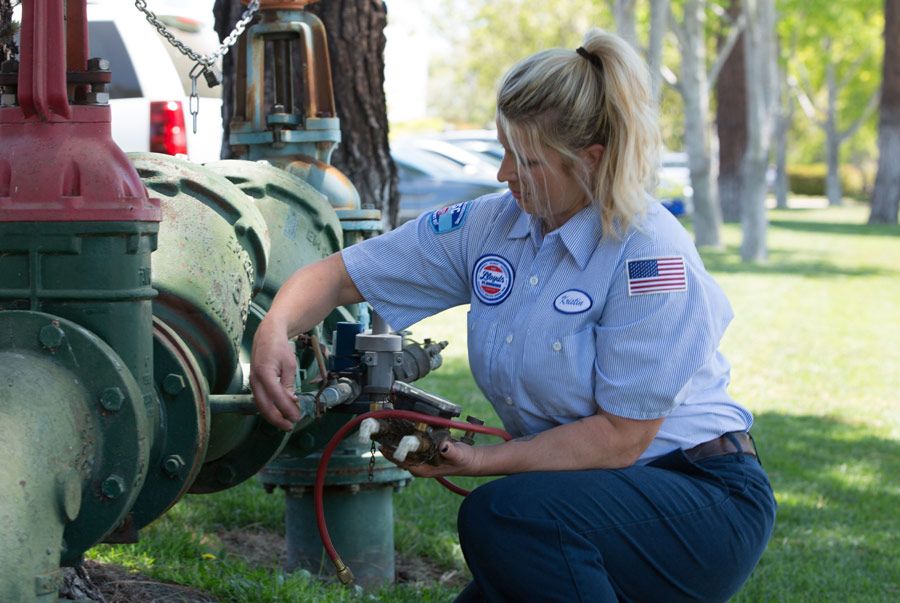 Plumber from Lloyd's Plumbing team doing backflow testing in Calabasas